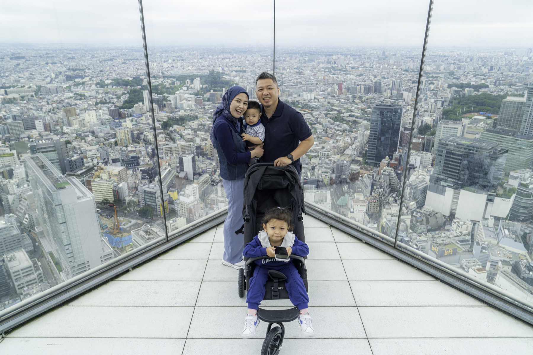Family enjoying a city view in Japan